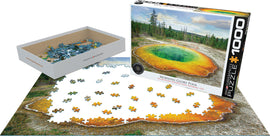 Eurographics Morning Glory Pool jigsaw puzzle featuring a vibrant image of Yellowstone National Park's iconic thermal feature. The puzzle contains 1000 pieces and is shown in its box alongside scattered pieces and a partially completed layout.