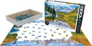 Eurographics Rocky Mountain National Park jigsaw puzzle featuring a stunning image of Colorado's Rocky Mountains. The puzzle includes 1000 pieces and is shown partially assembled, with pieces scattered around the box. The box displays vibrant colors of nature, including mountains, trees, and a reflective lake.