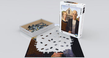 A jigsaw puzzle of the famous painting 'American Gothic' by Grant Wood, made by Eurographics. The puzzle features a partially completed image with pieces scattered around a neatly designed box. The box showcases the iconic artwork depicting a farmer and his daughter in front of a farmhouse, emphasizing fine art and challenging puzzle-solving.