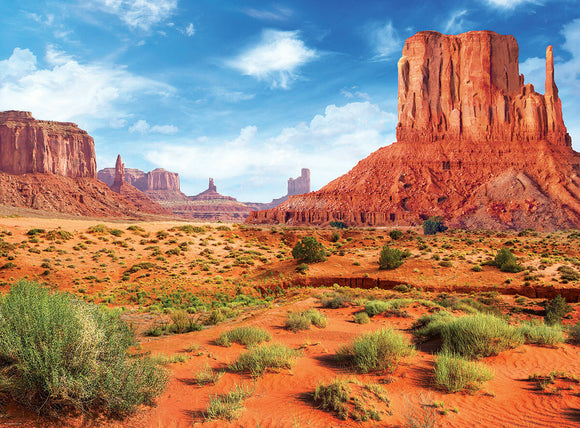 Monument Valley jigsaw puzzle by Eurographics featuring a stunning landscape of sandstone formations and vibrant blue sky. Ideal for puzzle lovers who appreciate natural beauty.