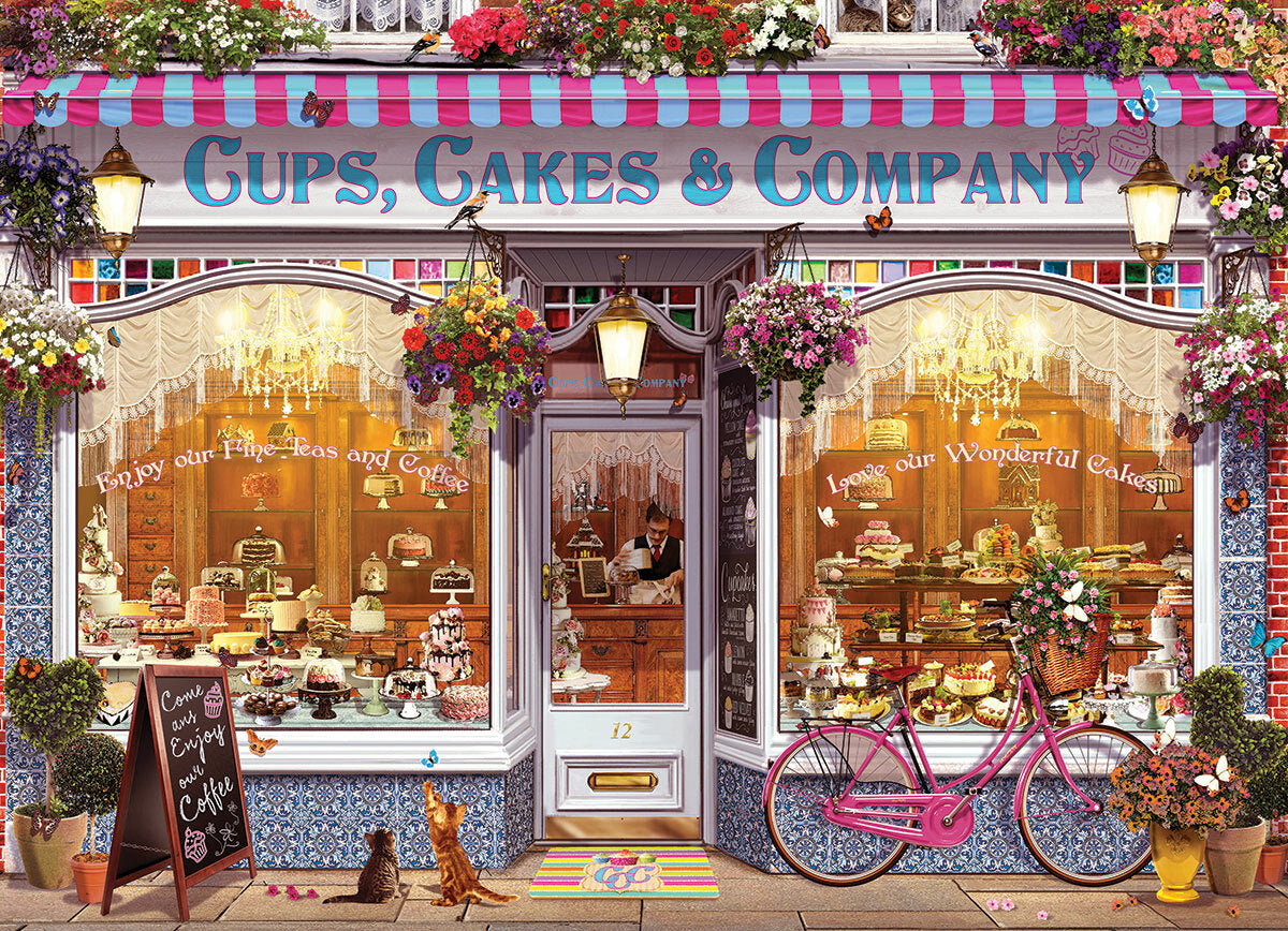 A beautifully illustrated jigsaw puzzle titled 'Cups, Cakes & Company' by Eurographics. The image depicts a charming bakery storefront adorned with colorful flowers, a bicycle, and a chalkboard sign inviting customers. Through the glass window, an array of delectable cakes and pastries can be seen, alongside a friendly waiter. The detailed artwork evokes a warm and inviting atmosphere, making it perfect for puzzle enthusiasts and bakery lovers alike.