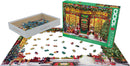 The Christmas Shop 1000-piece jigsaw puzzle by Eurographics. The box features a vibrant illustration of a festive Christmas shop, complete with holiday decorations, snowmen, and various toys. The puzzle pieces are displayed partially assembled on a surface, surrounded by scattered pieces. It showcases detailed imagery suitable for holiday-themed puzzle enthusiasts.