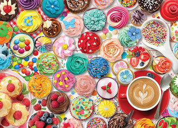 A vibrant assortment of colorful cupcakes and desserts, featuring various icing styles, sprinkles, and decorations. The background includes a cup of coffee on a red saucer, surrounded by a mix of cupcakes with flowers, fruits, and playful designs, creating a festive cupcake-themed atmosphere perfect for puzzle enthusiasts.
