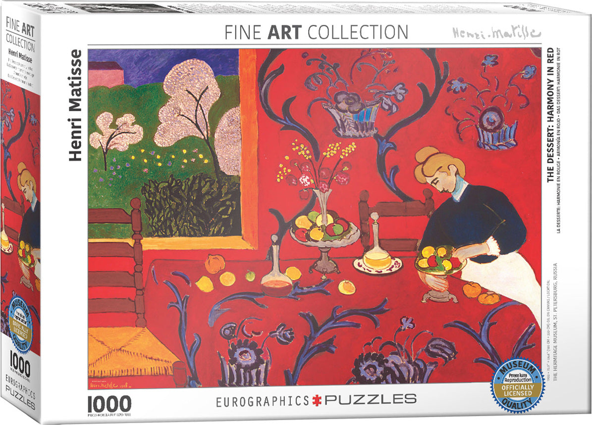 A jigsaw puzzle titled 'The Dessert: Harmony in Red' by Henri Matisse, featuring vibrant red tones, a table set with fruits, and a woman in a black dress. The packaging displays the Eurographics logo and details about the artwork's provenance and museum-quality reproduction status.