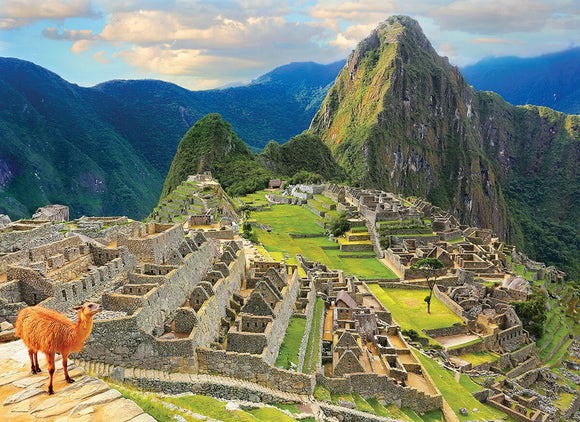 A scenic view of Machu Picchu, an ancient Incan city set amidst lush green mountains in Peru. The image features stone structures with terraced gardens and a llama in the foreground, under a bright blue sky.