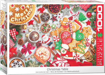 A festive jigsaw puzzle titled 'Christmas Table' featuring a beautifully arranged Christmas spread. The image showcases a variety of holiday treats, including decorated gingerbread cookies, colorful candies, and a rich hot chocolate, all set against a wooden table decorated with pine branches, festive ornaments, and presents. Ideal for puzzle enthusiasts and holiday lovers alike.