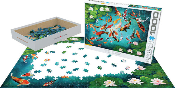 A beautifully illustrated 1000-piece jigsaw puzzle of koi fish by Eurographics. The puzzle features vibrant colors with various koi designs swimming amidst green lily pads and a blue background. The puzzle pieces are spread on a table with the partially completed image visible. The attractive packaging displays the artwork and product details prominently.