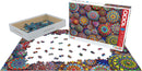 The Meditative Mandala Stones jigsaw puzzle by Eurographics features a vibrant design with colorful mandala patterns. The puzzle contains 1000 pieces and is partially assembled, showcasing intricate geometric shapes and bright colors. The package includes a well-designed box and a tray for sorting the pieces, making it ideal for mindful puzzle enthusiasts.