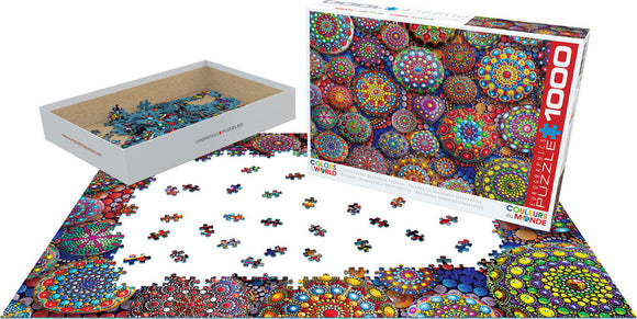 The Meditative Mandala Stones jigsaw puzzle by Eurographics features a vibrant design with colorful mandala patterns. The puzzle contains 1000 pieces and is partially assembled, showcasing intricate geometric shapes and bright colors. The package includes a well-designed box and a tray for sorting the pieces, making it ideal for mindful puzzle enthusiasts.