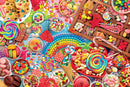 A colorful jigsaw puzzle titled 'Candy Party' by Eurographics, featuring a vibrant assortment of candies, lollipops, chocolates, and cookies, all arranged in a playful, eye-catching display. The scene is filled with textures and colors, including rainbow candy beads, jellybeans, and an array of sweets in various shapes and sizes.