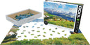 Eurographics Mountain Elk jigsaw puzzle featuring a scenic view of elk in a mountainous landscape. The 1000-piece puzzle is partially completed, with vibrant greens and blues showcasing nature. The puzzle box is displayed alongside the pieces, highlighting the high-quality imagery and design.