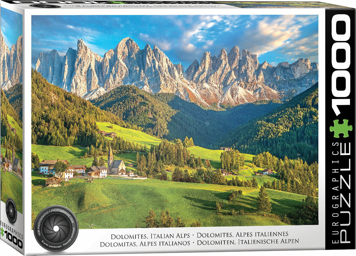 A close-up view of the Dolomites, Italian Alps jigsaw puzzle by Eurographics. The puzzle box features a stunning landscape of towering mountain peaks, lush green valleys, and charming villages set against a bright blue sky, showcasing the natural beauty of the Italian Alps. The box includes 1000 pieces for an engaging puzzling experience.