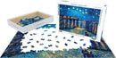 Starry Night Over the Rhone jigsaw puzzle by Eurographics featuring Vincent van Gogh's iconic artwork. The box is open, showing a portion of the assembled puzzle surrounded by an array of scattered pieces. The puzzle contains 1000 pieces, offering a challenging and enjoyable experience for art lovers and puzzle enthusiasts alike.