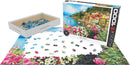 Eurographics jigsaw puzzle featuring a beautiful scene of Lake Como, Italy. The 1000-piece set includes vibrant flowers in the foreground and colorful buildings along the lakeshore, with pieces scattered and partially assembled.