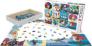 Eurographics Funny Birds jigsaw puzzle featuring whimsical illustrations of birds in humorous poses, with pieces scattered on a table and the box displaying vibrant artwork.