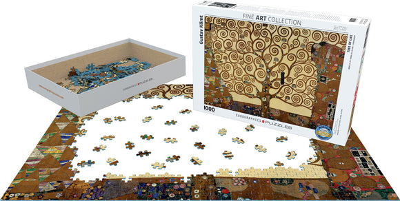 A 1000-piece jigsaw puzzle featuring Gustav Klimt's 'Tree of Life'. The artwork shows swirling patterns and a stylized tree on a golden background. The puzzle pieces are spread out on a table, with some assembled and others still in the box, showcasing the intricate details and colors of the image.