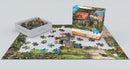 The Country Shed jigsaw puzzle by Dominic Da, displayed with its box. The scene features a charming country shed surrounded by vibrant flowers and greenery. A collection of colorful puzzle pieces is partially assembled on a flat surface, showcasing the beautiful artwork and intricate details. The box is positioned next to the puzzle, labeled with the title and '300 pieces'.