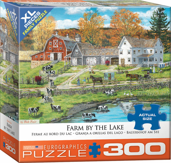 Farm by the Lake jigsaw puzzle featuring a serene rural scene, complete with red barns, farm animals like cows, and people engaging in farming activities, all set against a backdrop of trees in autumn colors. The puzzle includes 300 XL pieces, perfect for family enjoyment.