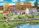 A serene jigsaw puzzle depicting a picturesque farm by a lake. The scene features a red barn, a white farmhouse, grazing cows, and horses pulling carts, all surrounded by colorful autumn trees and a tranquil water body reflecting the landscape.