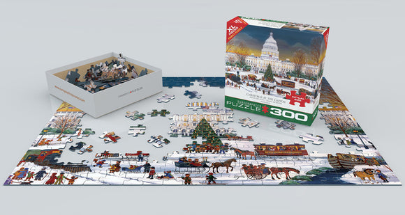 The 'Christmas at the Capitol' jigsaw puzzle by Eurographics shows a festive winter scene featuring the Capitol building, carriages, and people enjoying Christmas activities. The puzzle pieces are displayed on a flat surface alongside the neatly organized box.