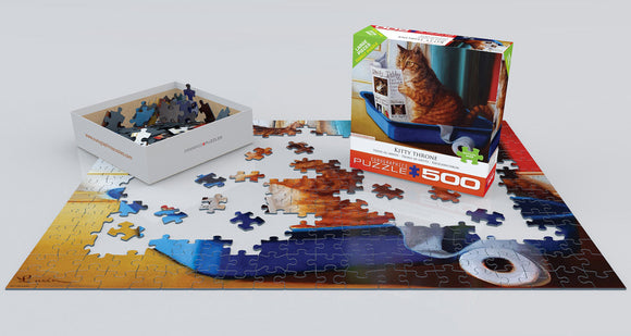 Kitty Throne jigsaw puzzle by Lucia Hefferna, featuring a cute cat sitting in a blue box with pieces scattered around. The puzzle comes in a colorful box with a 500-piece count, ideal for cat lovers and puzzle enthusiasts.