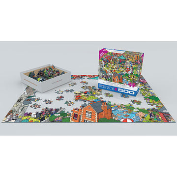 A vibrant jigsaw puzzle titled 'What Could Go Wrong?' by Eurographics is showcased with its box displayed. The puzzle features colorful, whimsical artwork spread out on a white surface, with several pieces already placed and a box of loose pieces nearby. The scene includes various buildings, characters, and playful elements, inviting puzzlers of all ages to engage in this fun challenge.