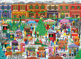 A festive jigsaw puzzle titled 'Downtown Holiday Festival' by Eurographics, depicting a vibrant winter market scene filled with cheerful people, decorated shops, snow-covered trees, and various vendor stalls selling holiday treats and toys.