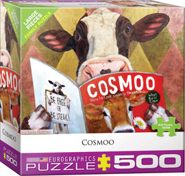 Cosmoo by Lucia Heffernan is a 500-piece jigsaw puzzle featuring a whimsical image of a cow reading a magazine titled 'Cosmoo: How to Look Udderly Beautiful.' The puzzle box showcases colorful artwork, including a speech bubble stating 'Be Free or Be Steak!' and various animal-themed illustrations, making it ideal for family fun.