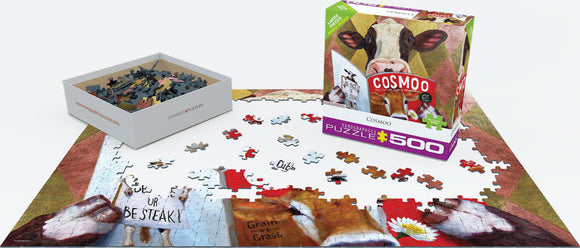 Cosmoo Jigsaw Puzzle by Lucia Heffernan featuring vibrant cow illustrations and humorous text. The puzzle pieces are scattered in a box alongside the partially assembled colorful image on a white mat.