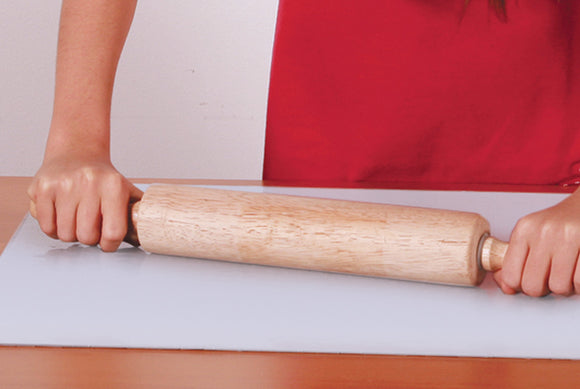 Eurographics Individual Smart Puzzle Glue S for jigsaw puzzles. The bottle features a twist cap, ideal for applying glue to completed puzzle surfaces for preservation. Shows hands using the glue bottle on a puzzle laid out on a table.