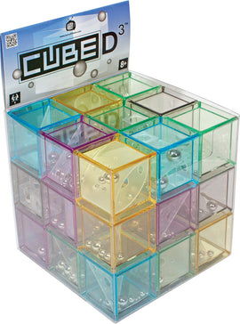 A colorful cube-shaped maze featuring transparent, multicolored plastic pieces arranged in a pattern. Each section contains a small metal ball that can be maneuvered through various paths. The exterior displays the product title 'Cubed 3' along with a recommended age of 8+. This engaging maze game encourages problem-solving and tactile interaction.