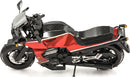 A detailed DIY model kit of the Kawasaki GPz900R motorcycle, featuring intricate metallic pieces in red and black. The model showcases realistic design elements including handlebars, wheels, and engine details, perfect for enthusiasts and collectors.