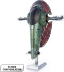 A detailed model of Boba Fett's Starfig from Star Wars, showcased in flying configuration. The model features a green and red exterior with intricate details, mounted on a silver base for display. Ideal for fans of DIY kits and the Star Wars universe.
