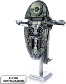 A detailed view of the Premium S: Boba Fett's Starfig DIY kit by Fascinations. The model features intricate designs and a flying configuration, displayed on a sturdy stand. The spacecraft showcases a mix of dark green and metallic hues, capturing the essence of the iconic character from Star Wars.