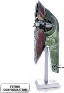 A detailed model of Boba Fett's Starfig from Star Wars, displayed in flying configuration. The model features intricate paintwork in olive green and deep red, showcasing various panels and detailing typical of spacecraft. It is mounted on a sleek display stand labeled with the model name.
