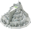 A detailed DIY model kit of Minas Tirith from the Lord of the Rings, showcasing its intricate architecture, layered cityscape, and iconic towers, all designed for assembly. The model features grey and white tones with accented rooftops, nestled against a mountainous backdrop.