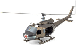 A detailed metal model kit of the UH-1 Huey helicopter, showcasing intricate design elements. The helicopter features a brown and gray color scheme with a red cross symbol on the front. The rotor blades are positioned above the aircraft, and the open cabin highlights the interior structure. This DIY kit is perfect for aviation enthusiasts and model builders.
