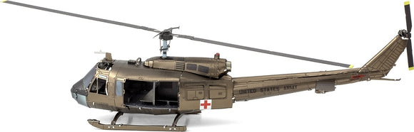 Detailed model kit of the UH-1 Huey helicopter by Fascinations. The helicopter features realistic design elements, including windows, rotor blades, and authentic markings. It is a metal construction kit, perfect for DIY enthusiasts and aviation fans.