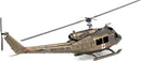 A detailed metal model of a UH-1 Huey helicopter, showcasing its intricate design with military-style markings. The model features a bronze finish, spinning rotors, and a red cross emblem, highlighting its iconic status. Perfect for DIY enthusiasts and collectors.