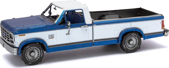 A detailed model of a 1982 Ford F-150 truck by Fascinations. The model features a striking blue and white color scheme with accurate detailing, including a well-crafted interior and realistic wheels. Perfect for DIY enthusiasts and collectors, this Metal Earth kit provides a rewarding building experience.