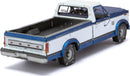 Detailed model kit of a 1982 Ford F-150 pickup truck by Fascinations. The model showcases a two-tone color scheme of white and blue with intricate detailing on the body, wheels, and interior. Perfect for DIY enthusiasts and collectors, this kit offers a rewarding building experience, capturing the essence of a classic American truck.