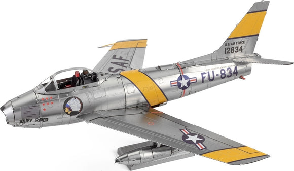 A detailed DIY metal model kit of the F-86 Sabre aircraft by Fascinations, showcasing intricate design and silver metallic finish with yellow accents. The model features realistic details such as cockpit seating and military insignia.
