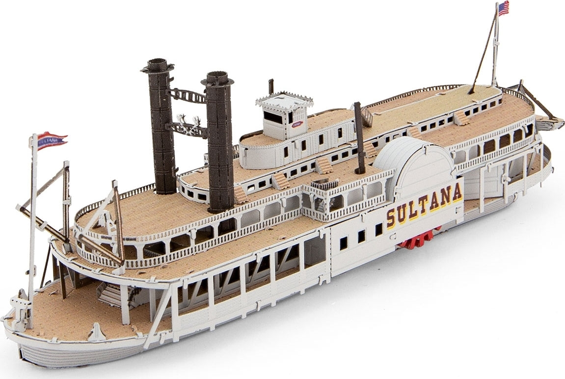 A detailed model kit of the Sultana Steamboat by Fascinations, showcasing intricate features including twin smokestacks, a paddle wheel, and realistic deck detailing. The kit comes in a metallic finish, representing a classic riverboat design, perfect for DIY enthusiasts and metal model builders.