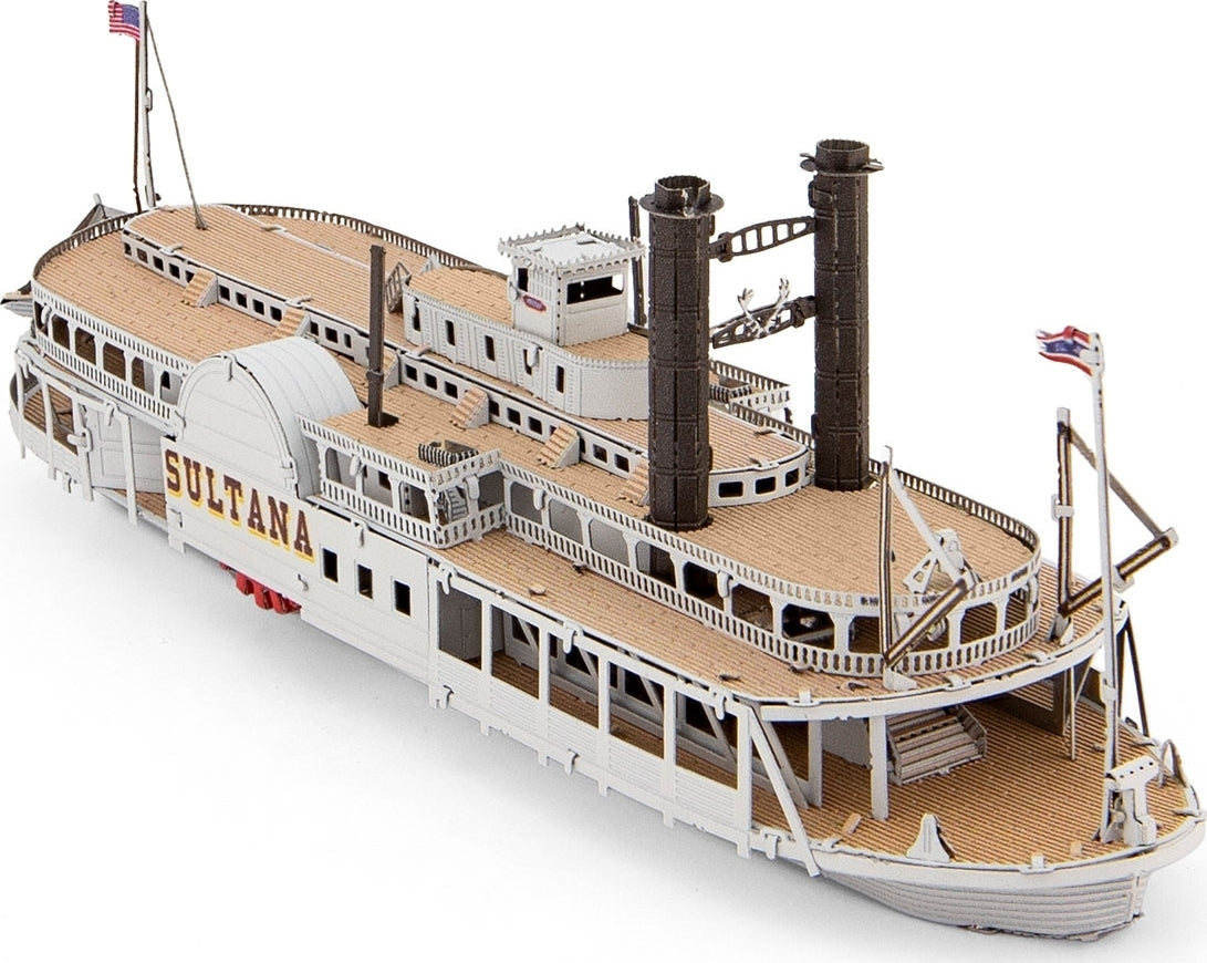 A detailed Metal Earth DIY kit of the Sultana Steamboat model, featuring intricate cut-out designs and a realistic structure with deck and smokestacks. The model showcases a classic steamboat with the name 'SULTANA' visible on the side, and is perfect for craft enthusiasts who enjoy building miniature replicas.