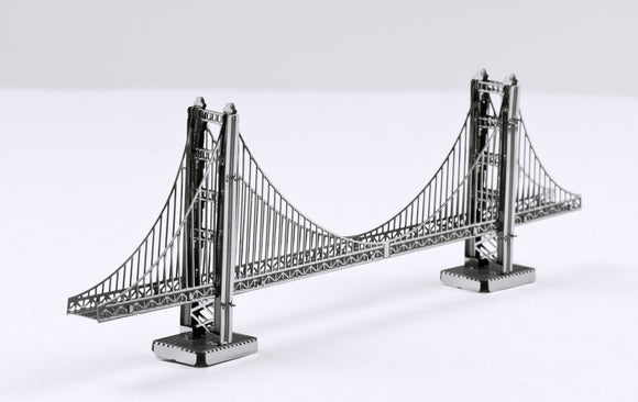 A detailed model of the Golden Gate Bridge crafted from metal, showcasing intricate designs and high-quality construction. The metallic finish highlights the suspension cables and towers, making it a perfect DIY kit for enthusiasts and collectors.