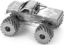 A detailed metal DIY kit of a Monster Truck made by Fascinations. The model features intricate metallic finishes and flame graphics, showcasing oversized tires and a rugged design, perfect for collectors and craft enthusiasts.