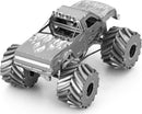 A detailed metal model of a monster truck by Fascinations. The truck features flame graphics, large metallic wheels, and a rugged design, making it an ideal DIY kit for enthusiasts.