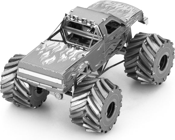 A detailed metal model of a monster truck by Fascinations. The truck features flame graphics, large metallic wheels, and a rugged design, making it an ideal DIY kit for enthusiasts.