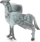 A detailed metallic model of Buckbeak, a mythical creature resembling a hippogriff, featuring intricate wings, claws, and a textured body. This DIY kit by Fascinations allows you to create your own 3D representation of Buckbeak for display or imaginative play.