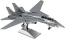 A detailed metal model kit of the F-14 Tomcat jet, showcasing its signature swept wings and cockpit with visible pilot seats. The model is mounted on a stand for display, featuring a shiny metallic finish.